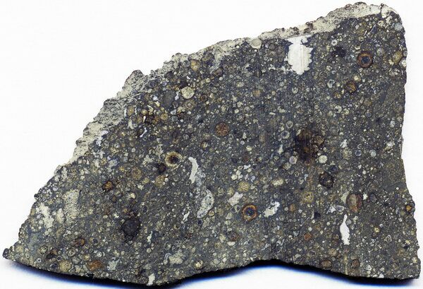 Carbonaceous chondrite (Allende Meteorite) in cross-section.  Photo Credit: James St. John